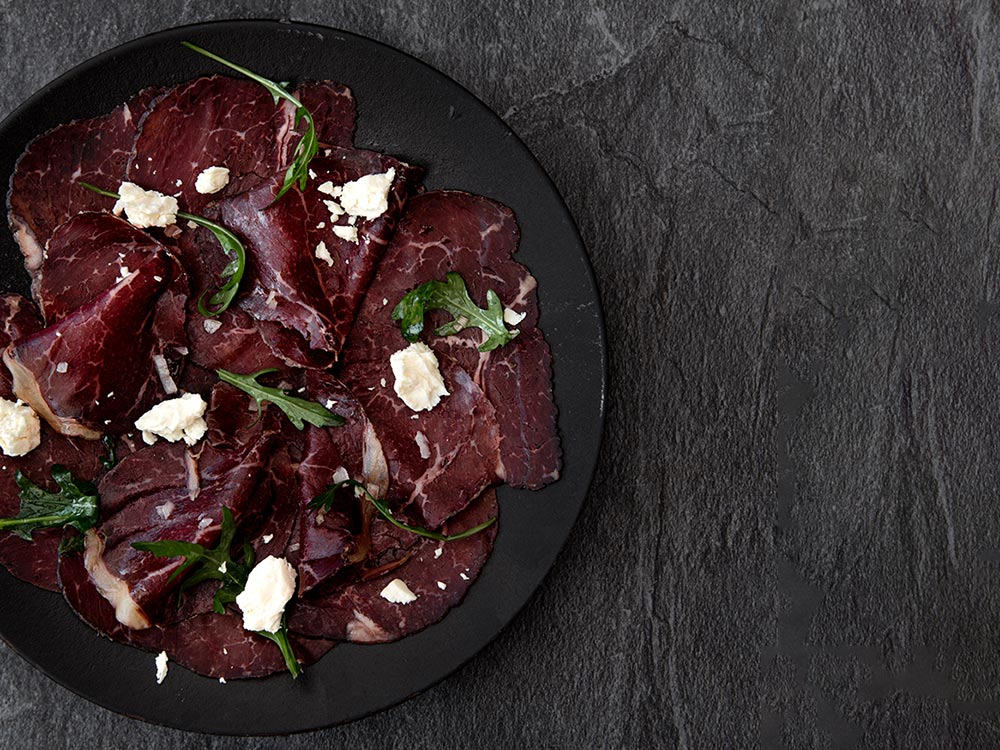 Fowlescombe Farm Beef Bresaola with Rocket and shaved Parmesan