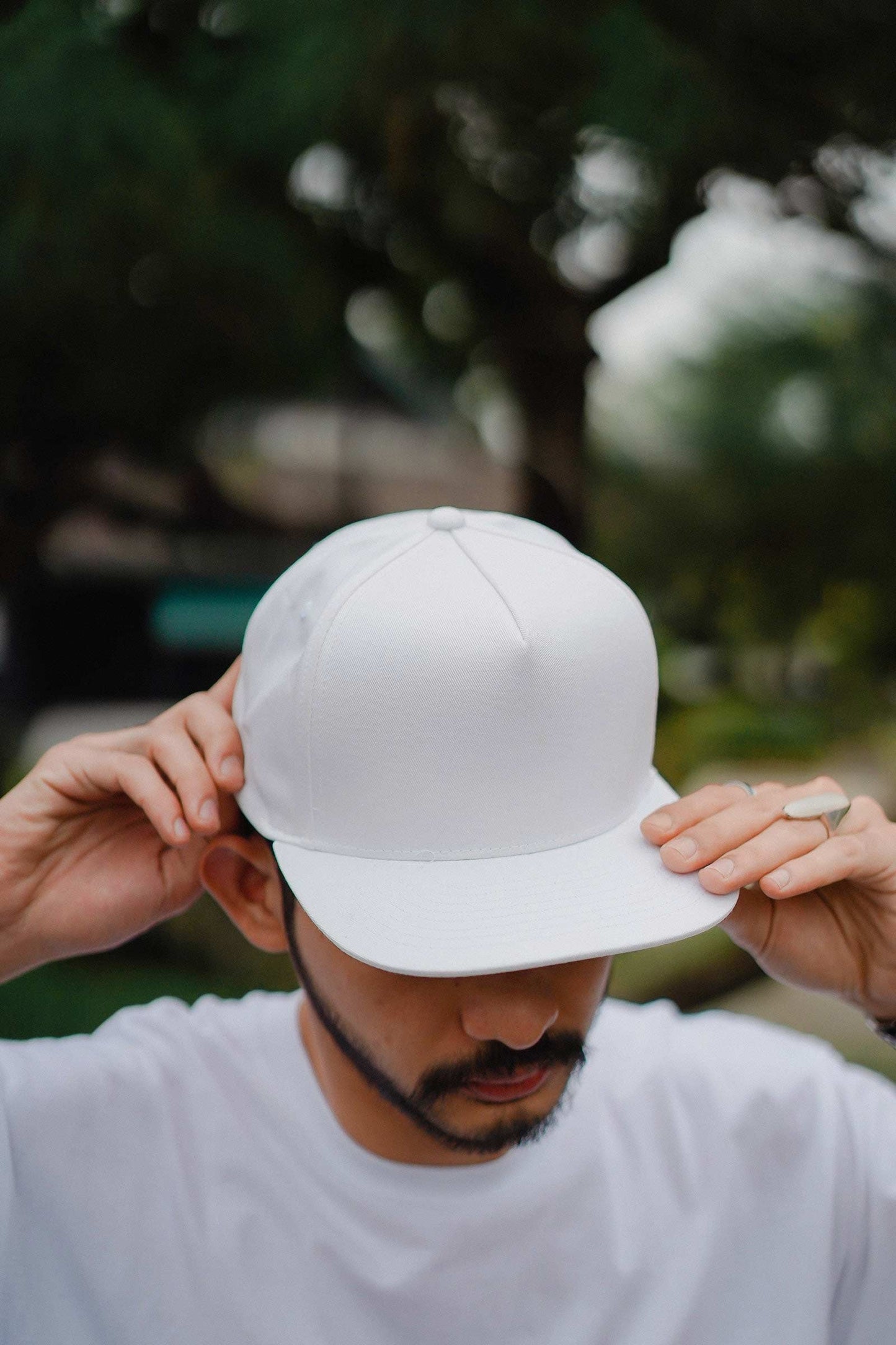 Man wearing a white cap