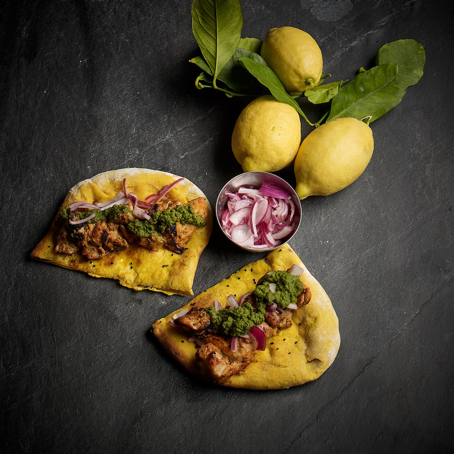 Chicken Tikka kebab with buttered naan, nigella seeds and a coriander and pickled red onion relish