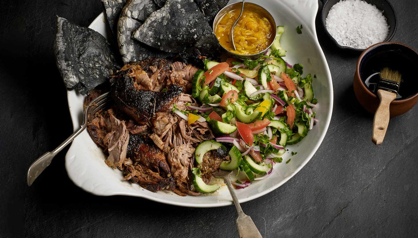 Slow cooked lamb shoulder with tumeric naan, mango chutney and kachumber