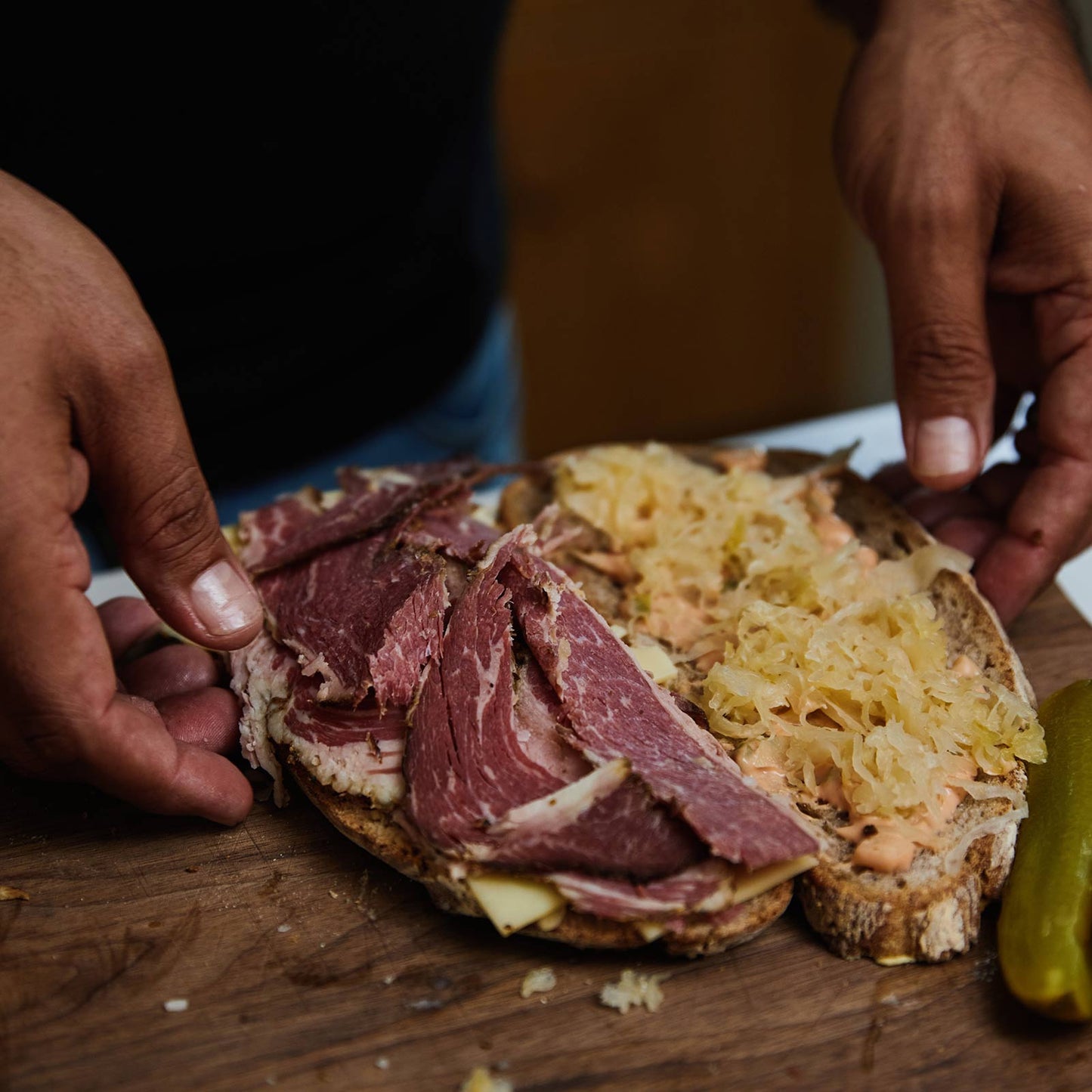 Preparing a Reuben sandwich with Rare and Pasture Pastrami